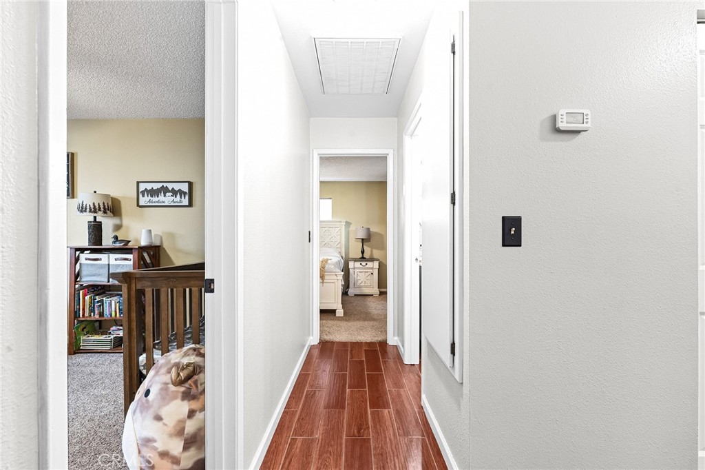 3985 Front Street Chico, CA 95928 - Photo 17 of 55 a view of a hallway with wooden floor and a livingroom