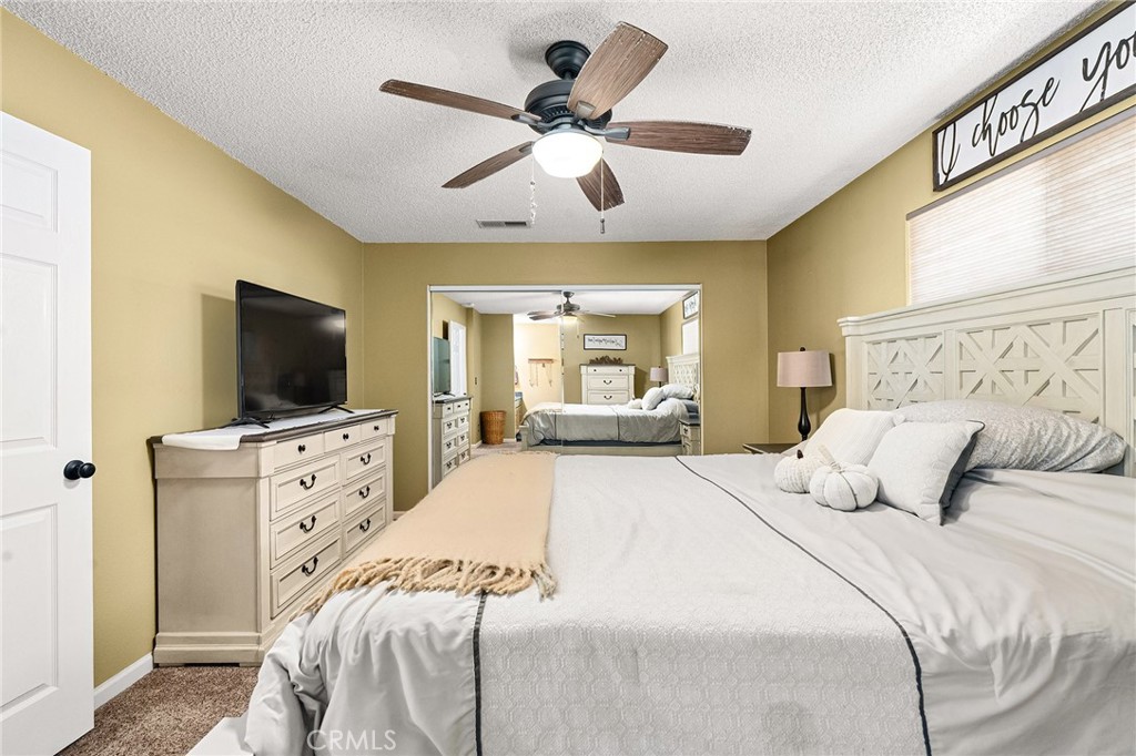 3985 Front Street Chico, CA 95928 - Photo 18 of 55 a bedroom with a large bed and flat tv