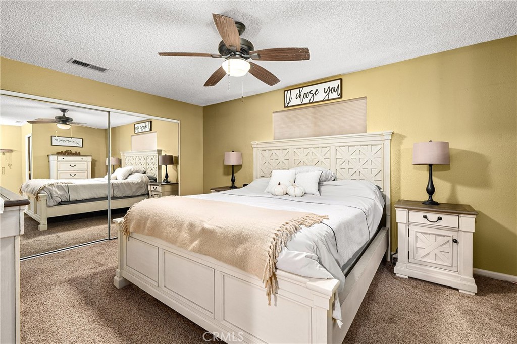 3985 Front Street Chico, CA 95928 - Photo 19 of 55 a bedroom with a bed and a chandelier