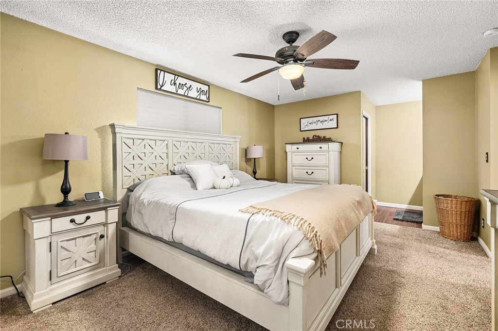 3985 Front Street Chico, CA 95928 - Photo 20 of 55 a bedroom with a large bed and a chandelier