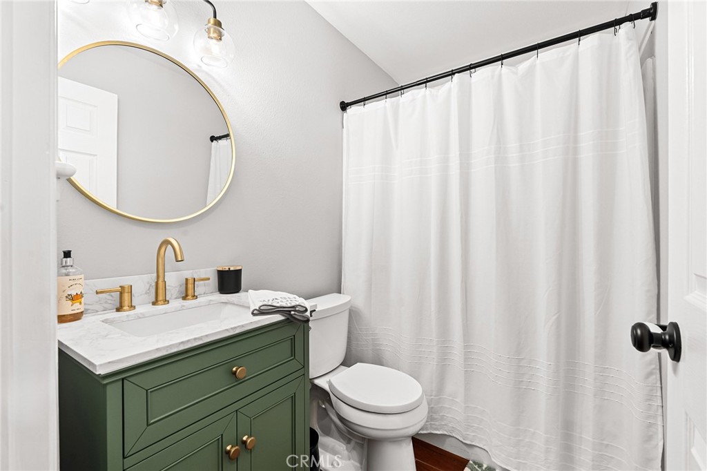 3985 Front Street Chico, CA 95928 - Photo 21 of 55 a bathroom with a sink a toilet and a mirror
