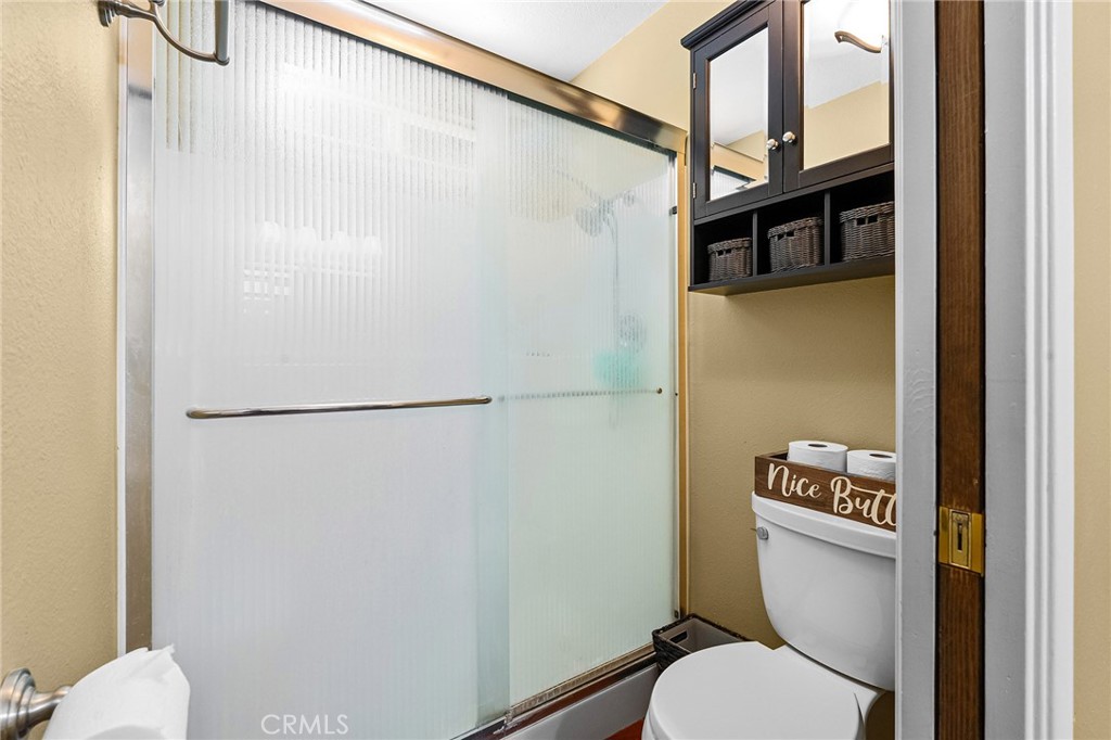 3985 Front Street Chico, CA 95928 - Photo 23 of 55 a white toilet sitting next to a bathroom sink