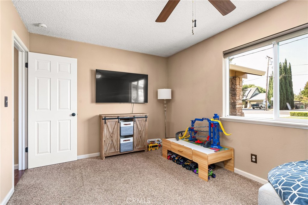 3985 Front Street Chico, CA 95928 - Photo 26 of 55 a living room with furniture and a flat screen tv