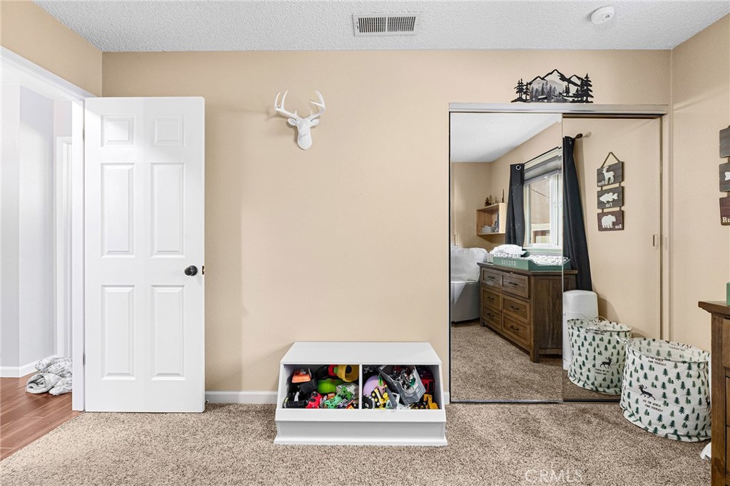 3985 Front Street Chico, CA 95928 - Photo 28 of 55 a living room with furniture and a chandelier