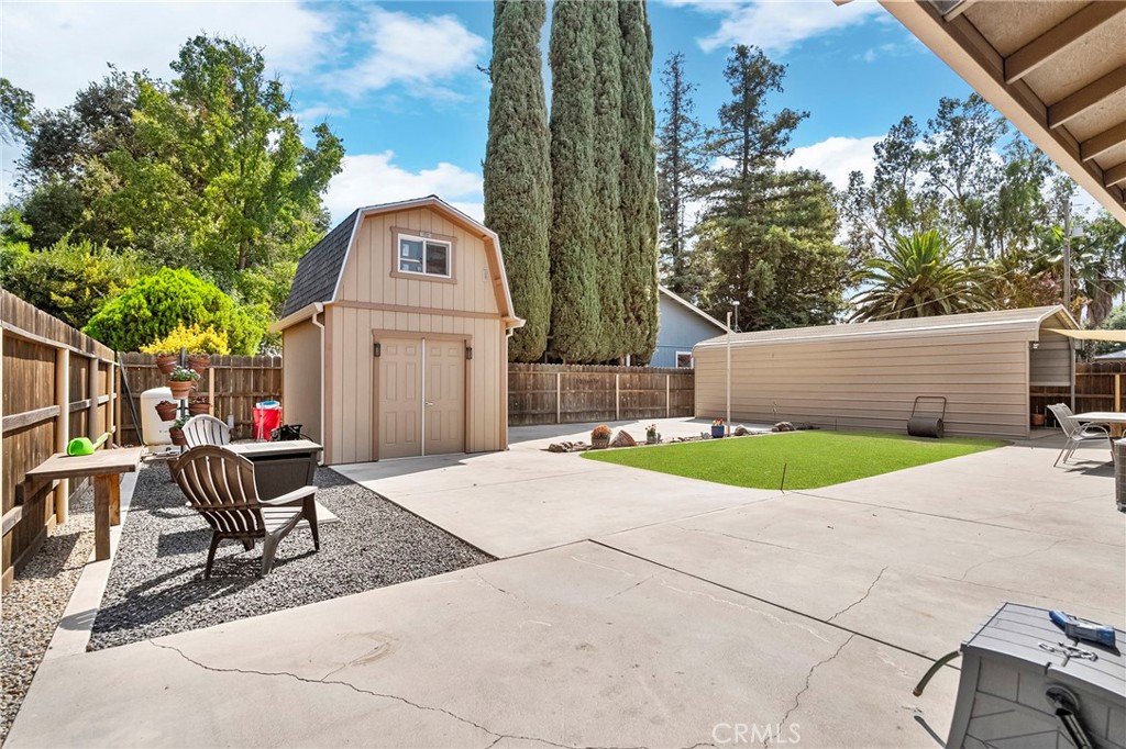 3985 Front Street Chico, CA 95928 - Photo 36 of 55 a view of a chair and table in the backyard of the house