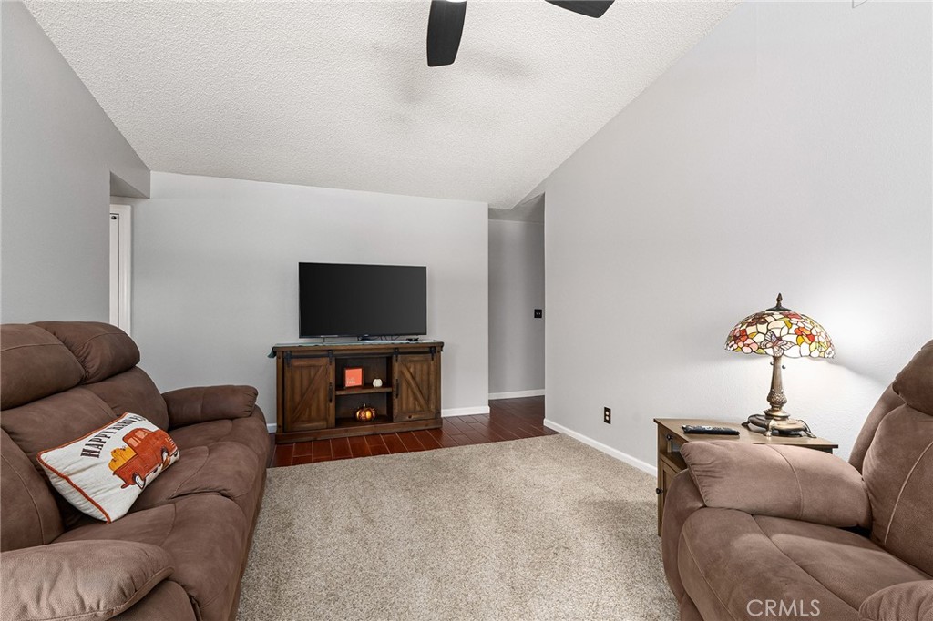 3985 Front Street Chico, CA 95928 - Photo 5 of 55 a living room with furniture and a flat screen tv
