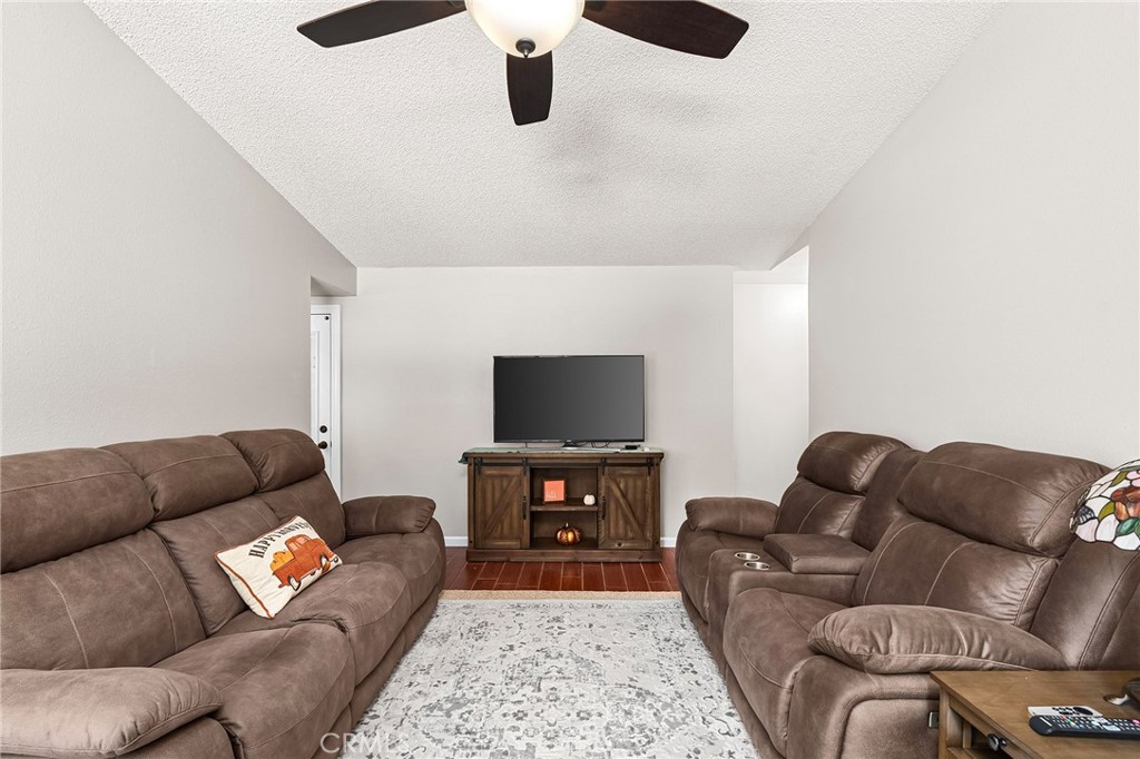 3985 Front Street Chico, CA 95928 - Photo 7 of 55 a living room with furniture and a flat screen tv
