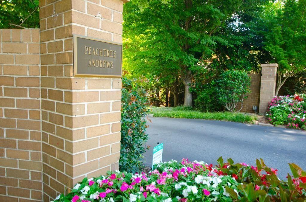 a sign that is in front of flowers