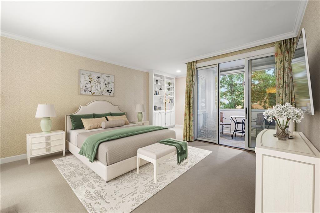 2734 Peachtree Road Northwest, Unit C404 Atlanta, GA 30305 - Photo 12 of 19 a bedroom with a large bed and a large window