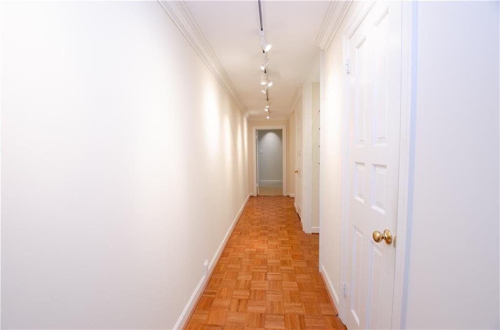 2734 Peachtree Road Northwest, Unit C404 Atlanta, GA 30305 - Photo 4 of 19 a view of a hallway with wooden floor
