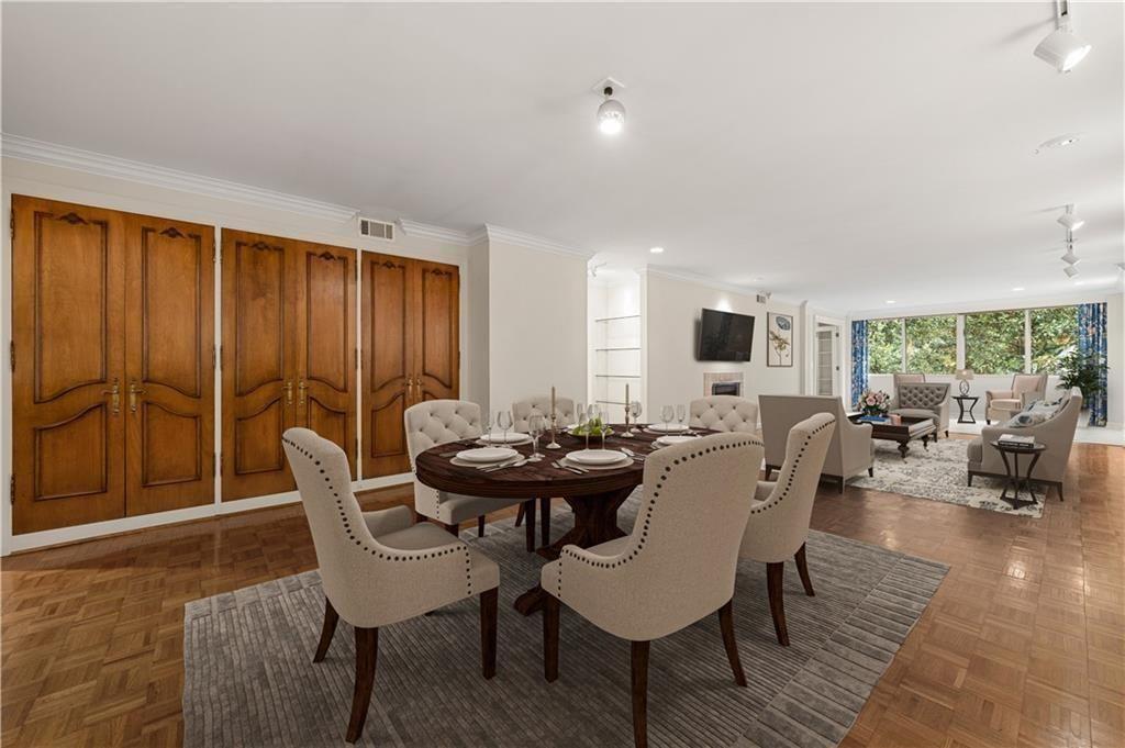 2734 Peachtree Road Northwest, Unit C404 Atlanta, GA 30305 - Photo 5 of 19 a view of a dining room with furniture and window