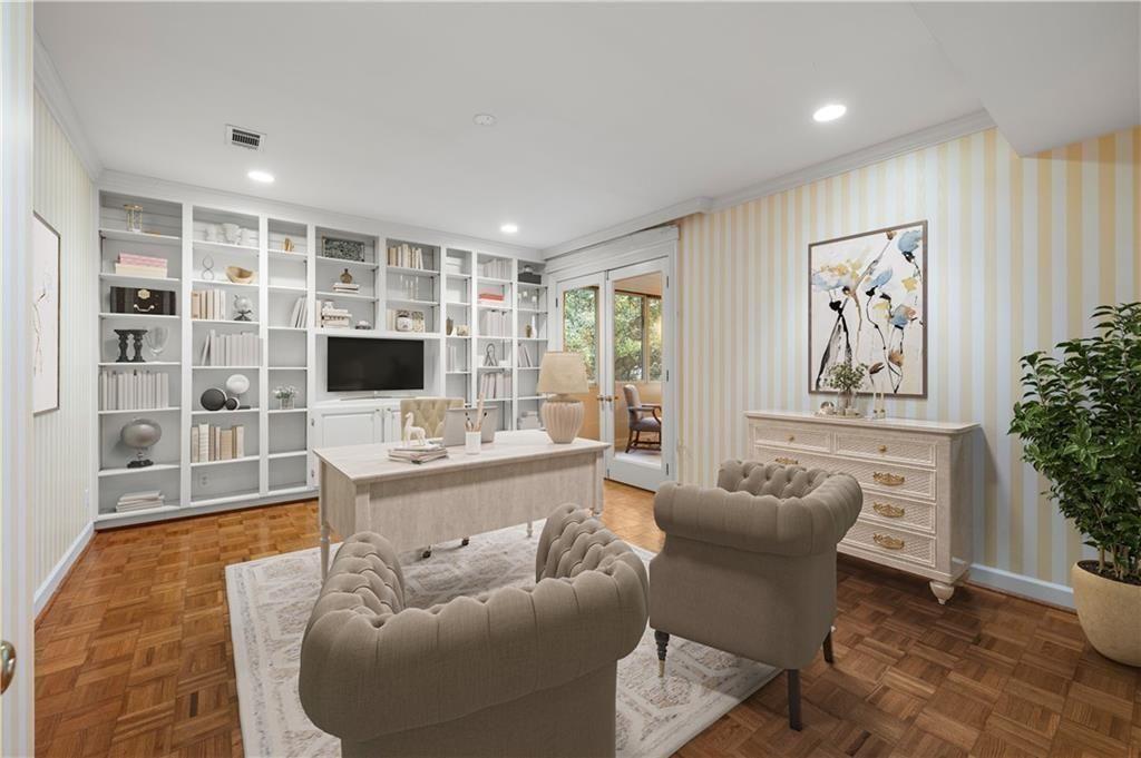 2734 Peachtree Road Northwest, Unit C404 Atlanta, GA 30305 - Photo 10 of 19 a living room with furniture a rug and a flat screen tv