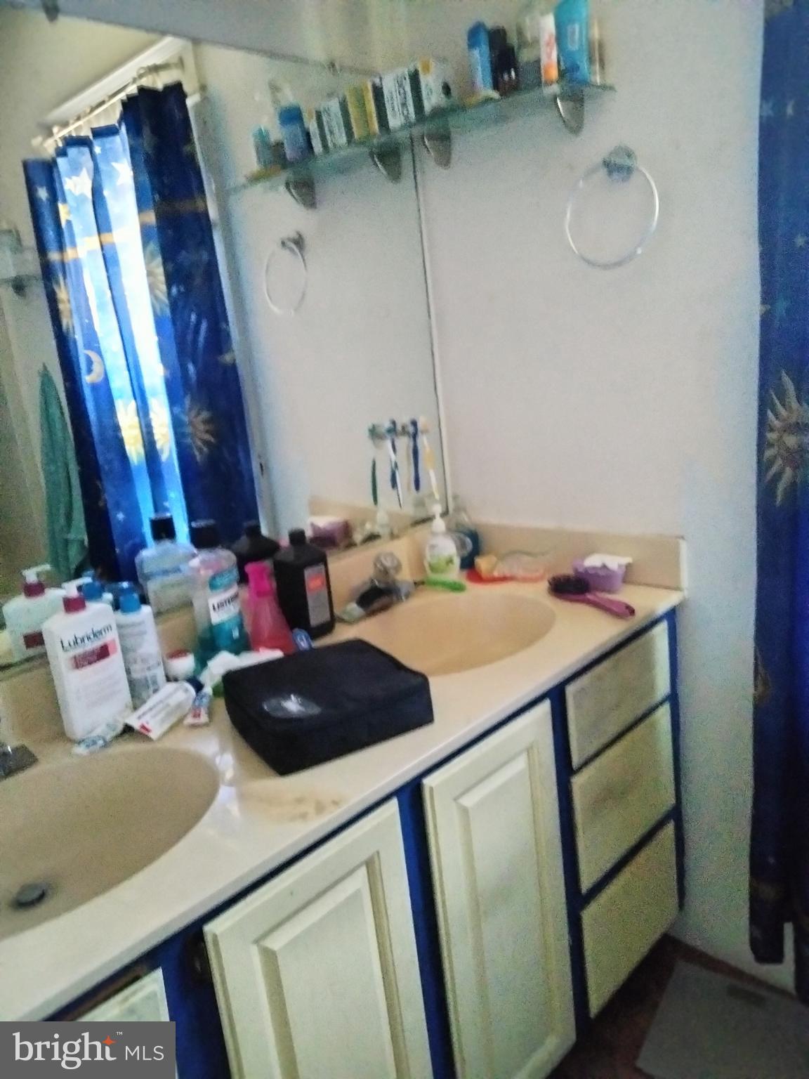 7411 Main Street Willards, MD 21874 - Photo 25 of 43 a bathroom with a sink and a mirror