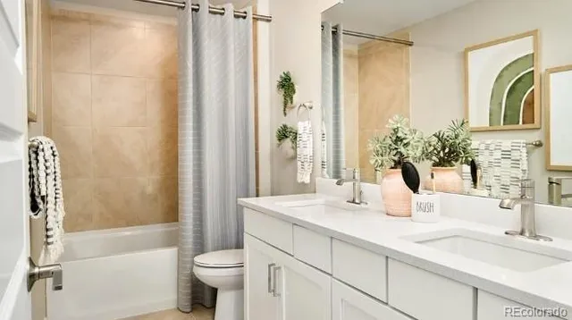 a kitchen with stainless steel appliances granite countertop a stove a refrigerator a microwave a dining table and chairs