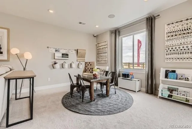 a view of a room that has a table and chair