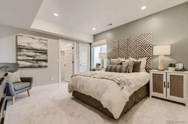 a living room with furniture or couch and a potted plant