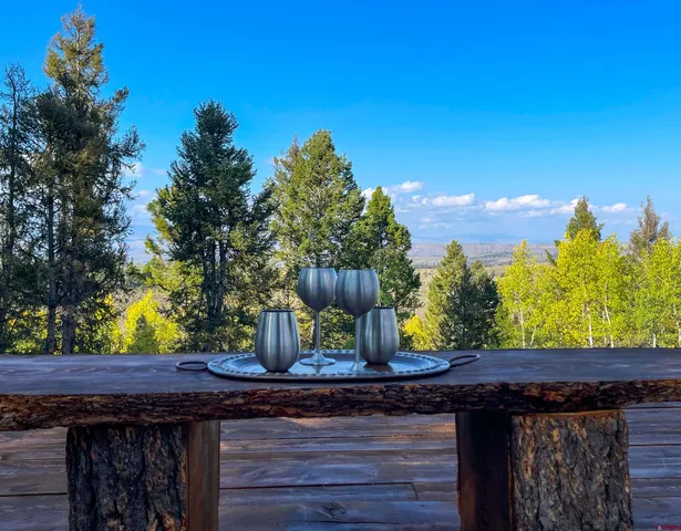 a backyard of a house with outdoor seating