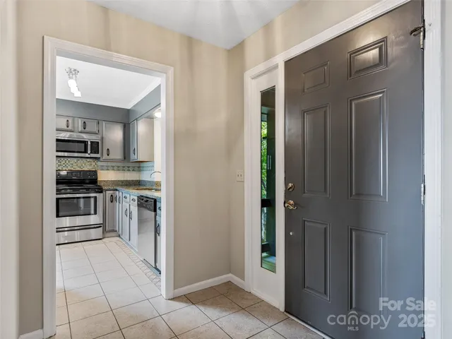 a kitchen with stainless steel appliances a refrigerator and a stove top oven