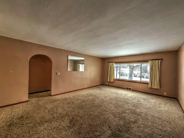 an empty room with windows