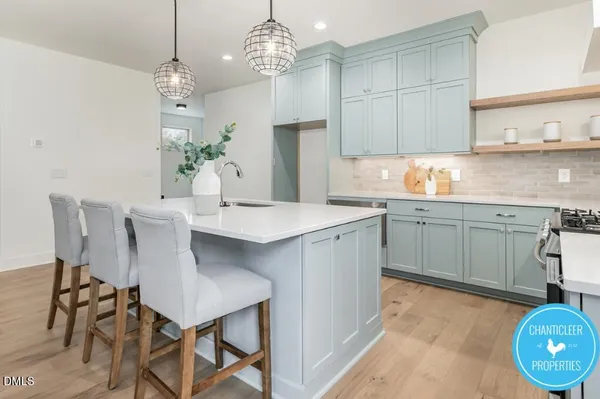 a kitchen with a table and chairs in it