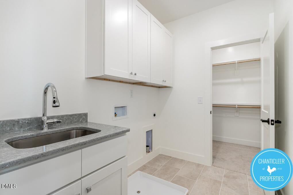 2307 Broad Street Durham, NC 27704 - Photo 21 of 29 a kitchen with a sink and cabinets