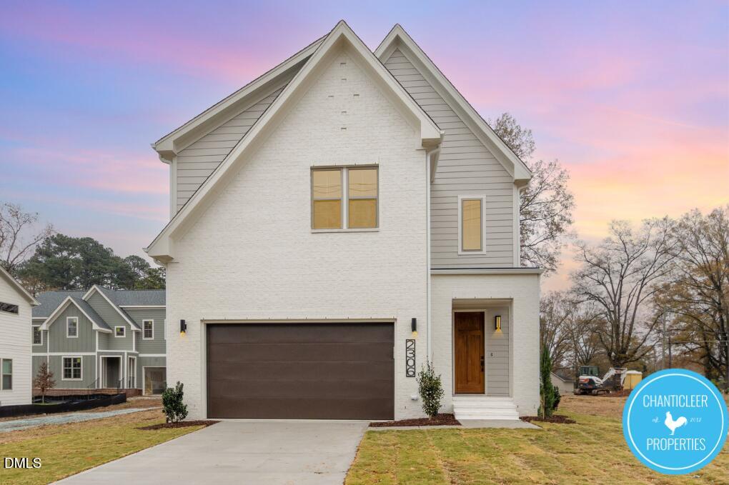 2307 Broad Street Durham, NC 27704 - Photo 4 of 29 a front view of a house with a garden