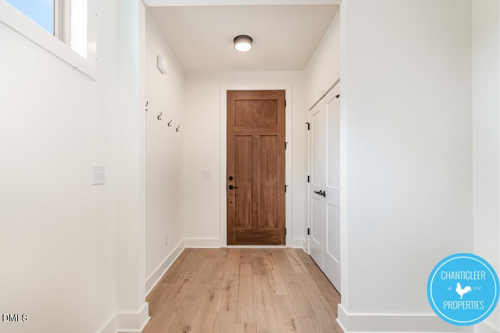 2307 Broad Street Durham, NC 27704 - Photo 6 of 29 a view of an empty room with wooden floor and a window