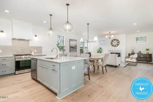 a large kitchen with lots of counter space and stainless steel appliances