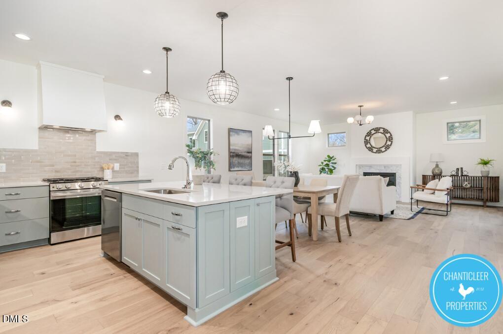 2307 Broad Street Durham, NC 27704 - Photo 9 of 29 a large kitchen with lots of counter space and stainless steel appliances