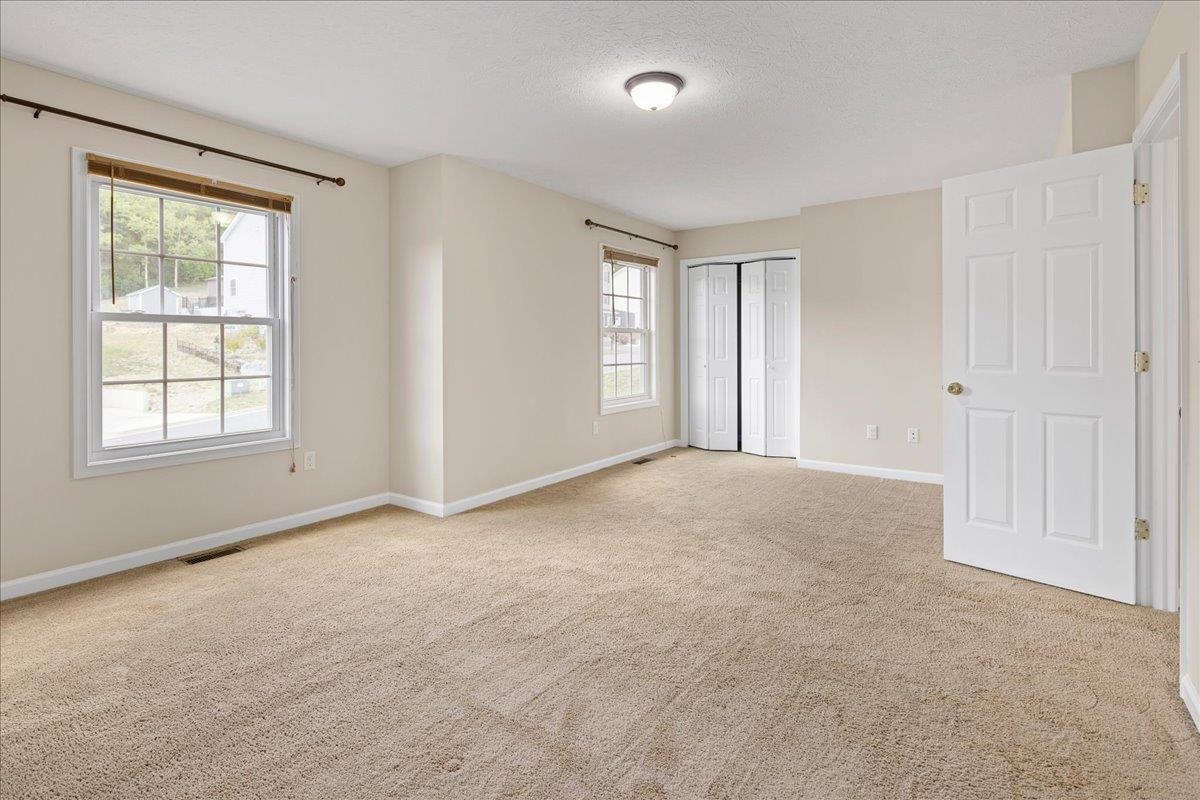 3265 Hebron Court Harrisonburg, VA 22801 - Photo 13 of 30 an empty room with windows and closet