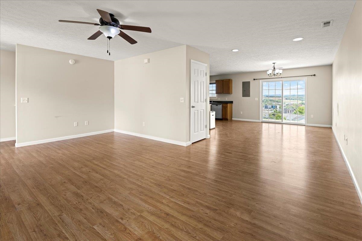 3265 Hebron Court Harrisonburg, VA 22801 - Photo 6 of 30 a view of a kitchen with wooden floor and a ceiling fan