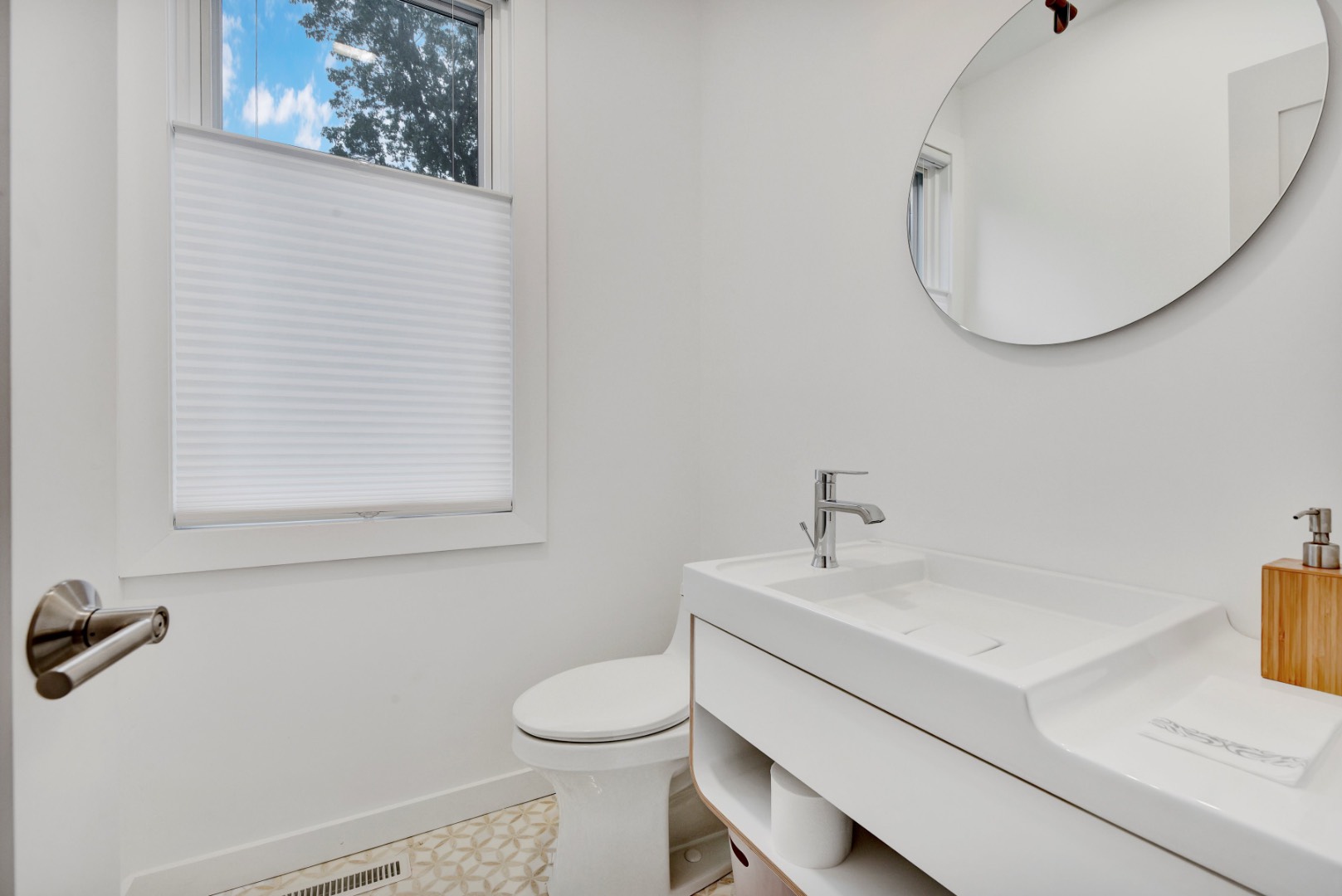 44 Richards Drive Sag Harbor, NY 11963 - Photo 13 of 37 a bathroom with a sink mirror and toilet
