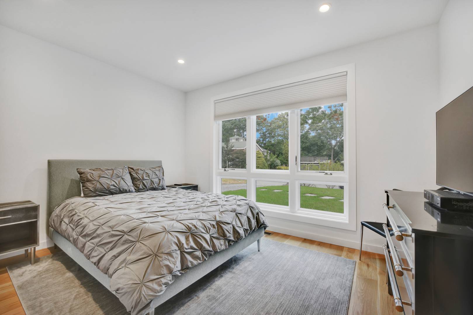 44 Richards Drive Sag Harbor, NY 11963 - Photo 14 of 37 a bedroom with a bed and a large window