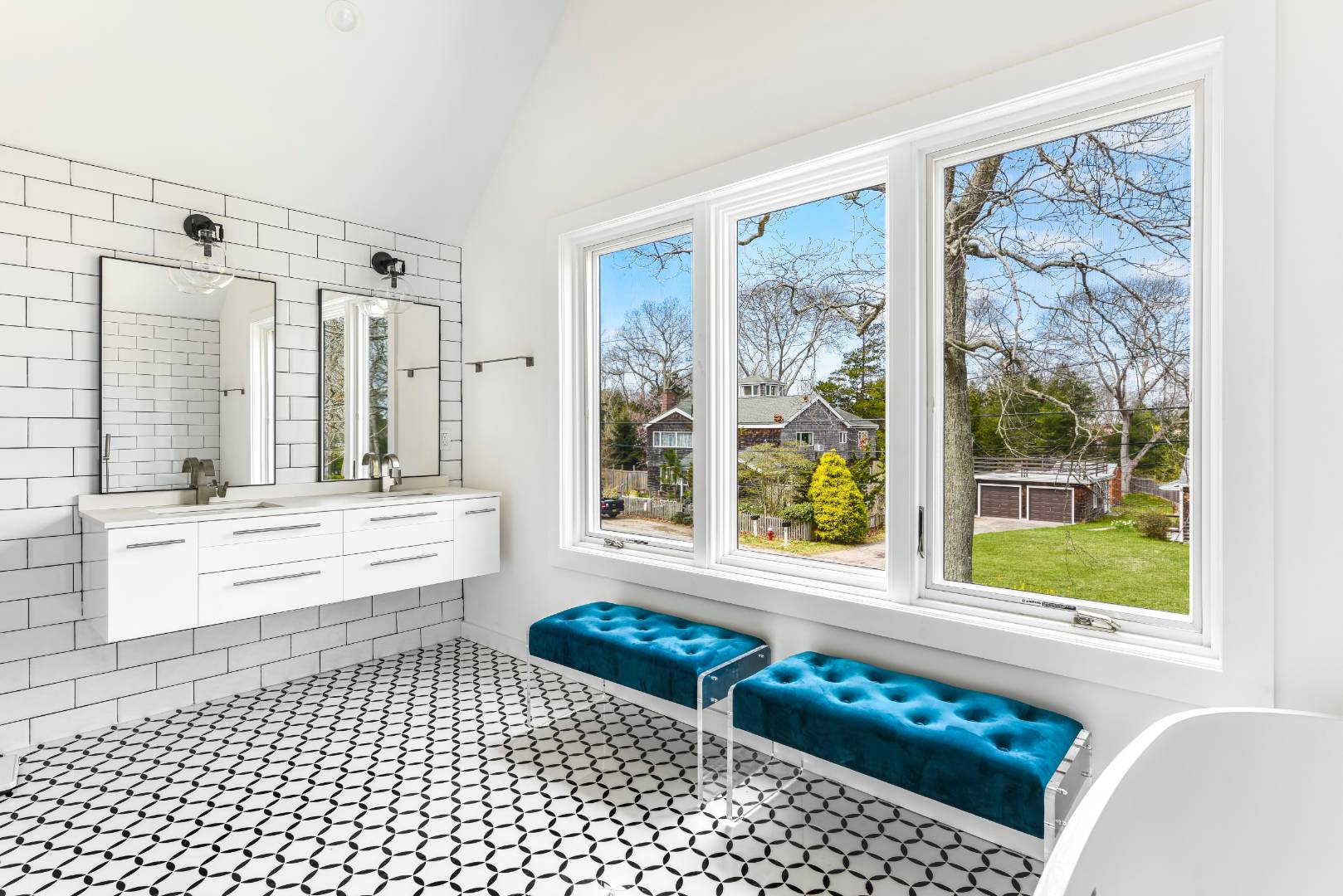 44 Richards Drive Sag Harbor, NY 11963 - Photo 19 of 37 a bathroom with a bathtub a sink and a large window