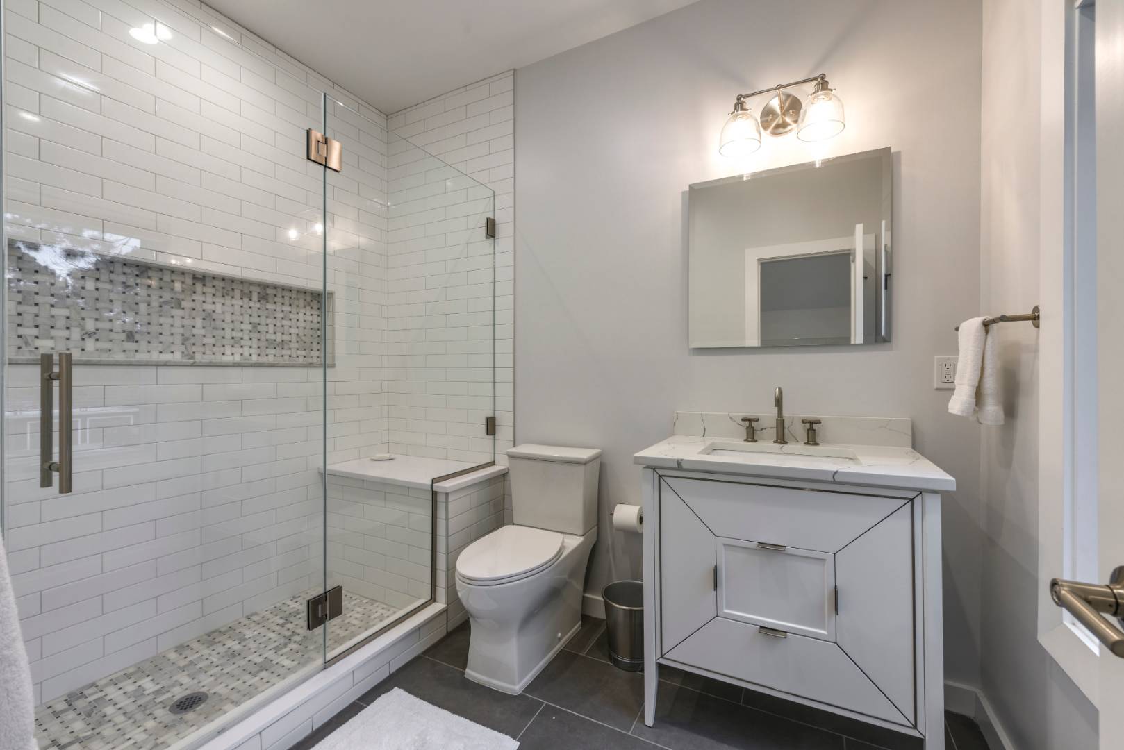 44 Richards Drive Sag Harbor, NY 11963 - Photo 24 of 37 a bathroom with a toilet sink vanity granite and shower