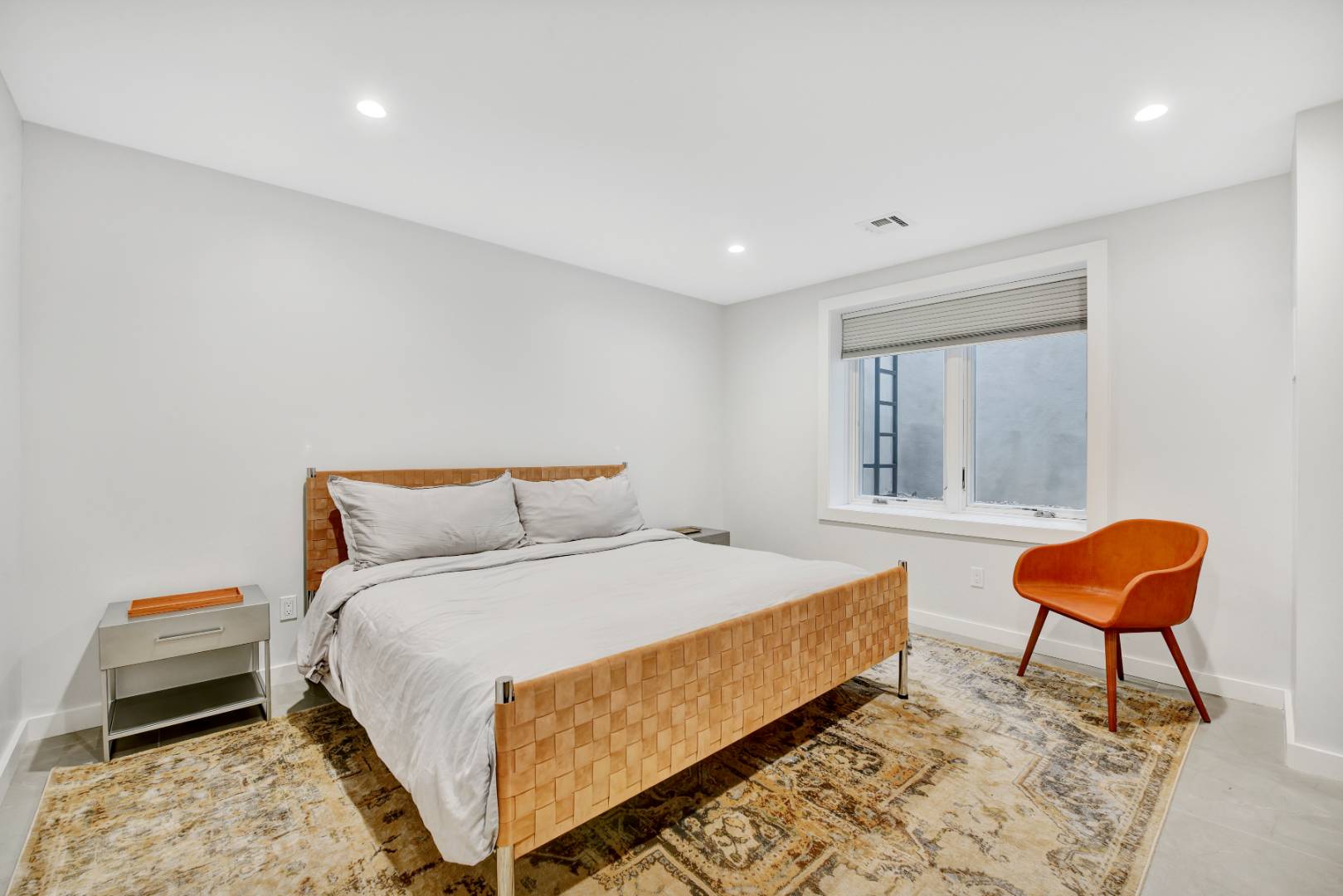 44 Richards Drive Sag Harbor, NY 11963 - Photo 25 of 37 a bedroom with a bed and a chair