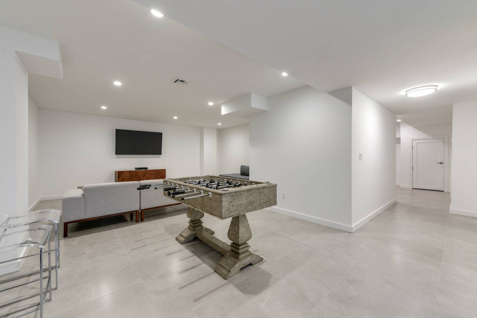 44 Richards Drive Sag Harbor, NY 11963 - Photo 29 of 37 a view of a living room kitchen with furniture and a flat screen tv