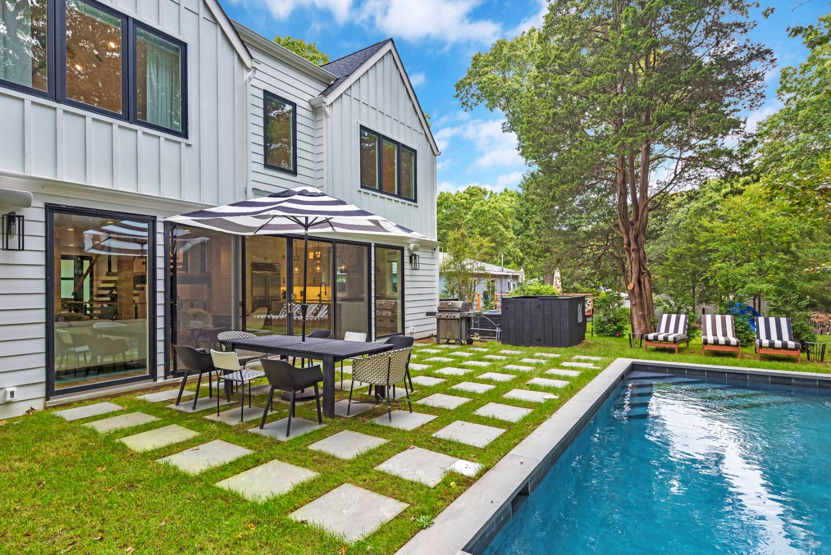 44 Richards Drive Sag Harbor, NY 11963 - Photo 34 of 37 a view of a house with pool and chairs