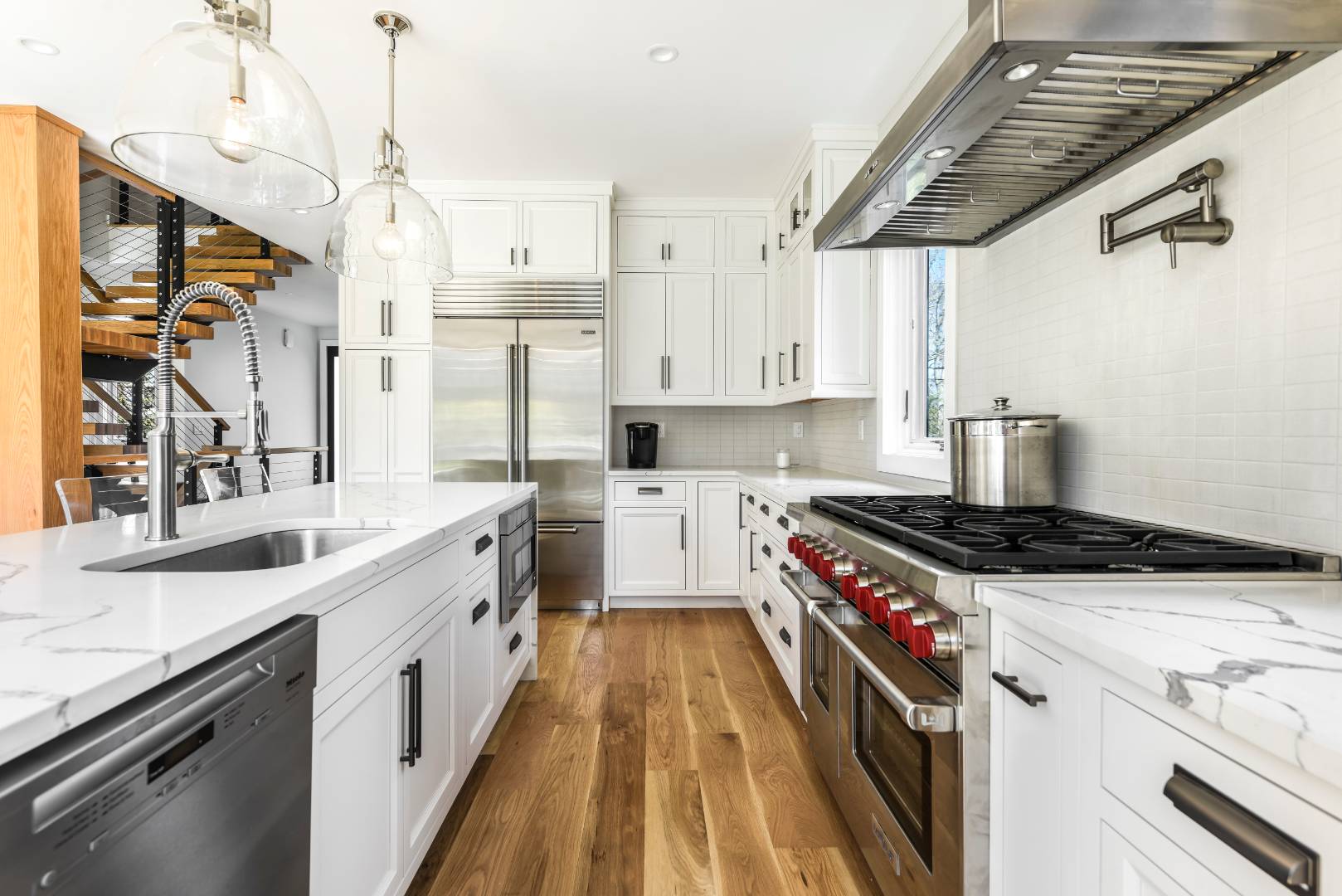 44 Richards Drive Sag Harbor, NY 11963 - Photo 7 of 37 a kitchen with stainless steel appliances granite countertop a stove and a sink