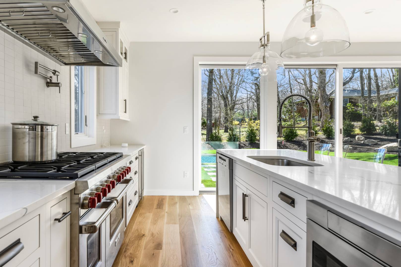44 Richards Drive Sag Harbor, NY 11963 - Photo 8 of 37 a kitchen with stainless steel appliances granite countertop a stove and a sink