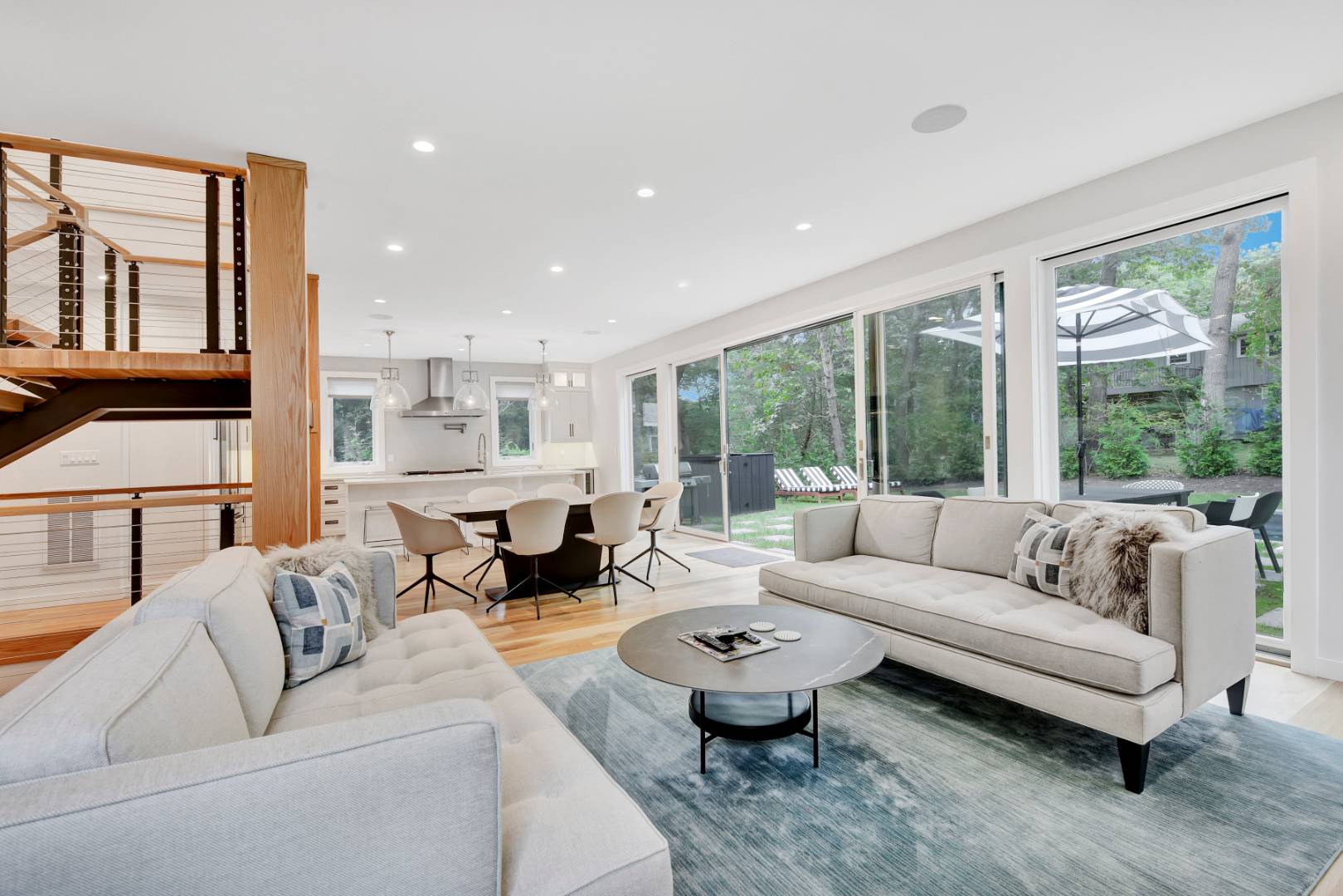 44 Richards Drive Sag Harbor, NY 11963 - Photo 10 of 37 a living room with furniture and large windows