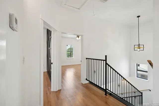 a view of a hallway with windows