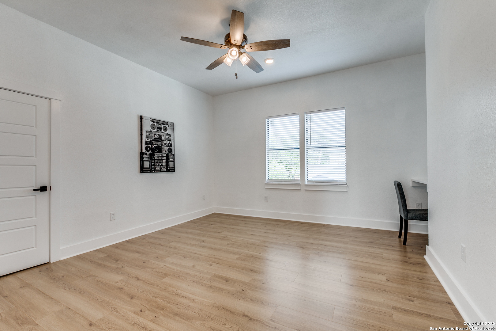 505 Rigsby Avenue San Antonio, TX 78210 - Photo 24 of 29 wooden floor in an empty room with a window