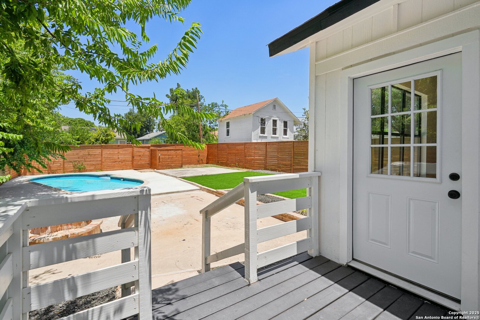 505 Rigsby Avenue San Antonio, TX 78210 - Photo 28 of 29 a view of balcony with a swing chair and wooden floor