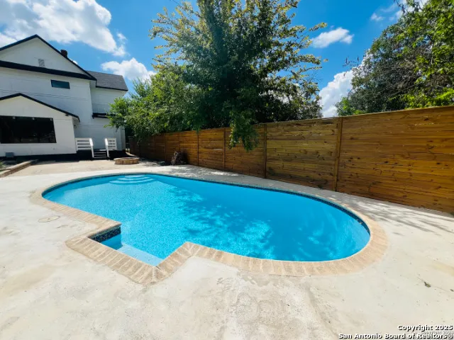 a view of a swimming pool with an outdoor space