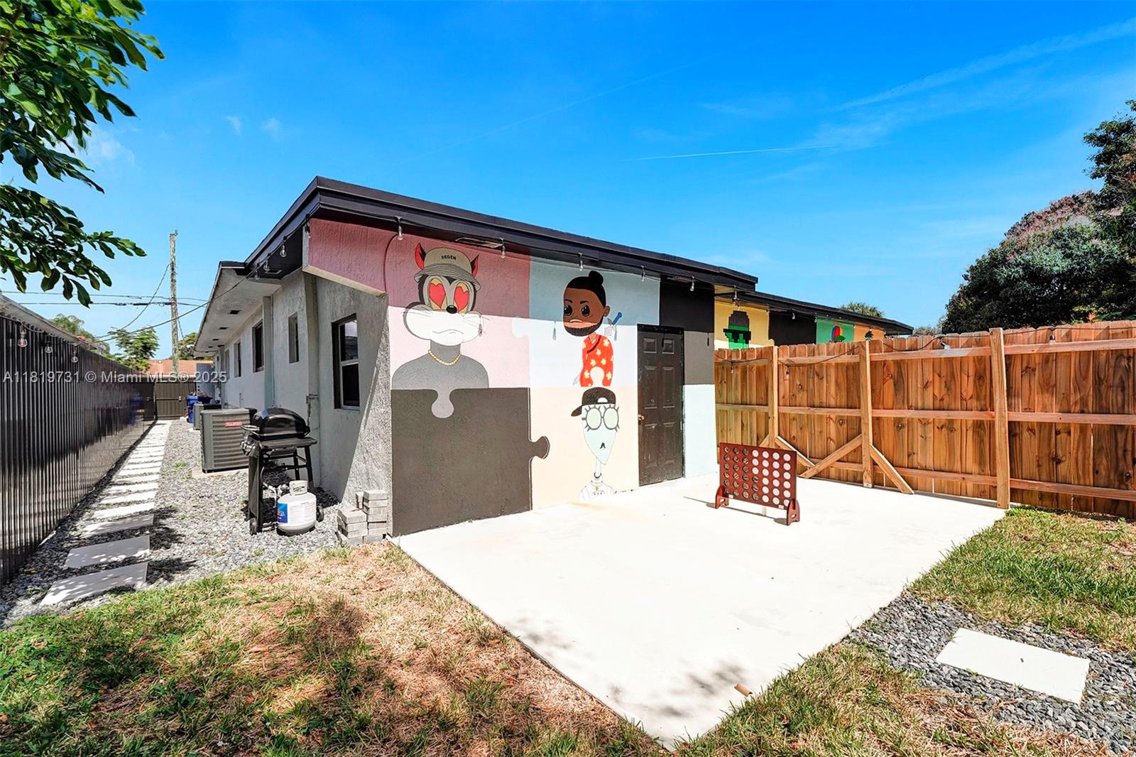 1324 Northeast 151st Street, Unit 1324 Miami, FL 33162 - Photo 23 of 23 a view of a house with wooden fence