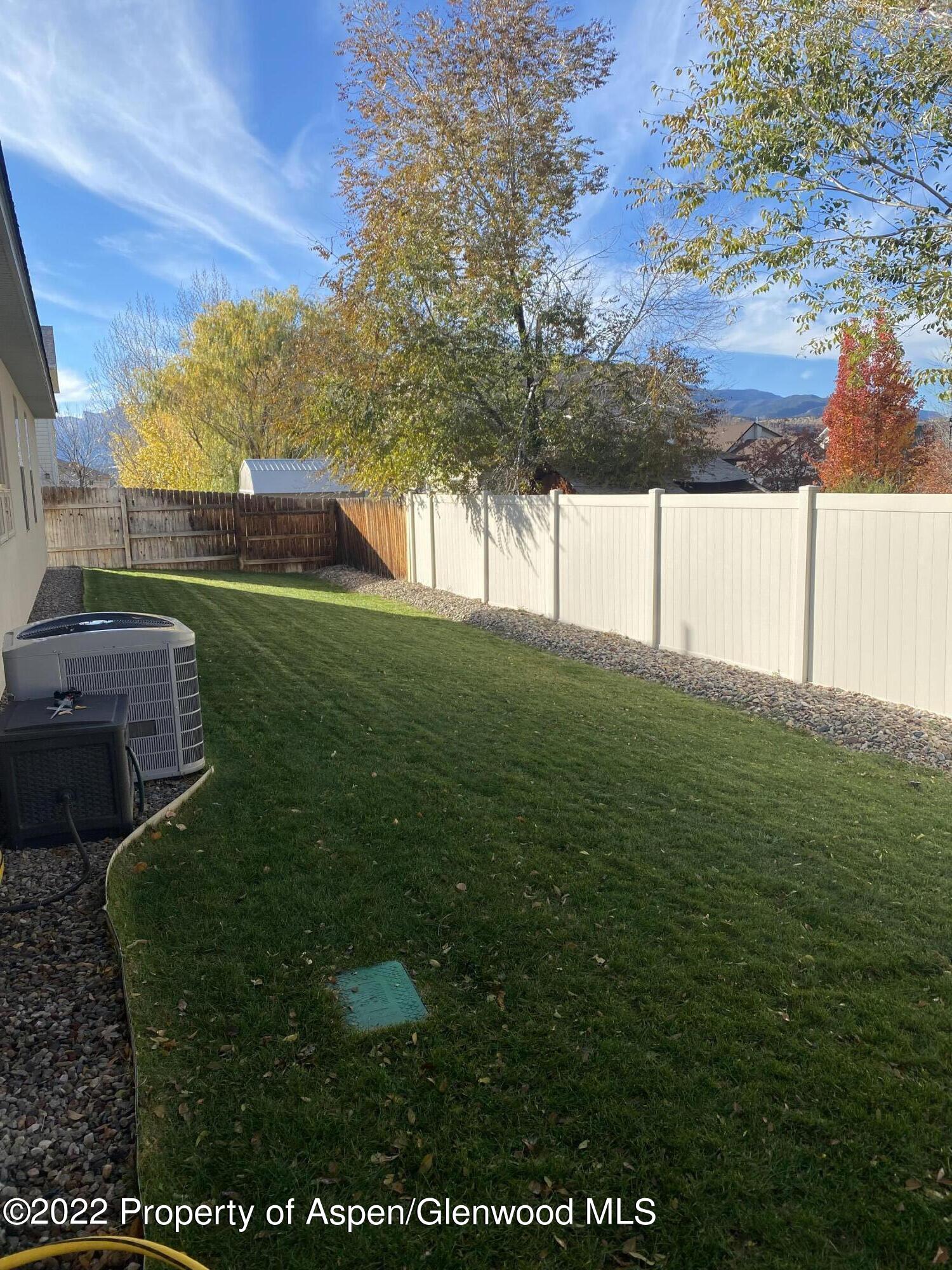 858 East 17th Street Rifle, CO 81650 - Photo 1 of 20 a view of yard with tree