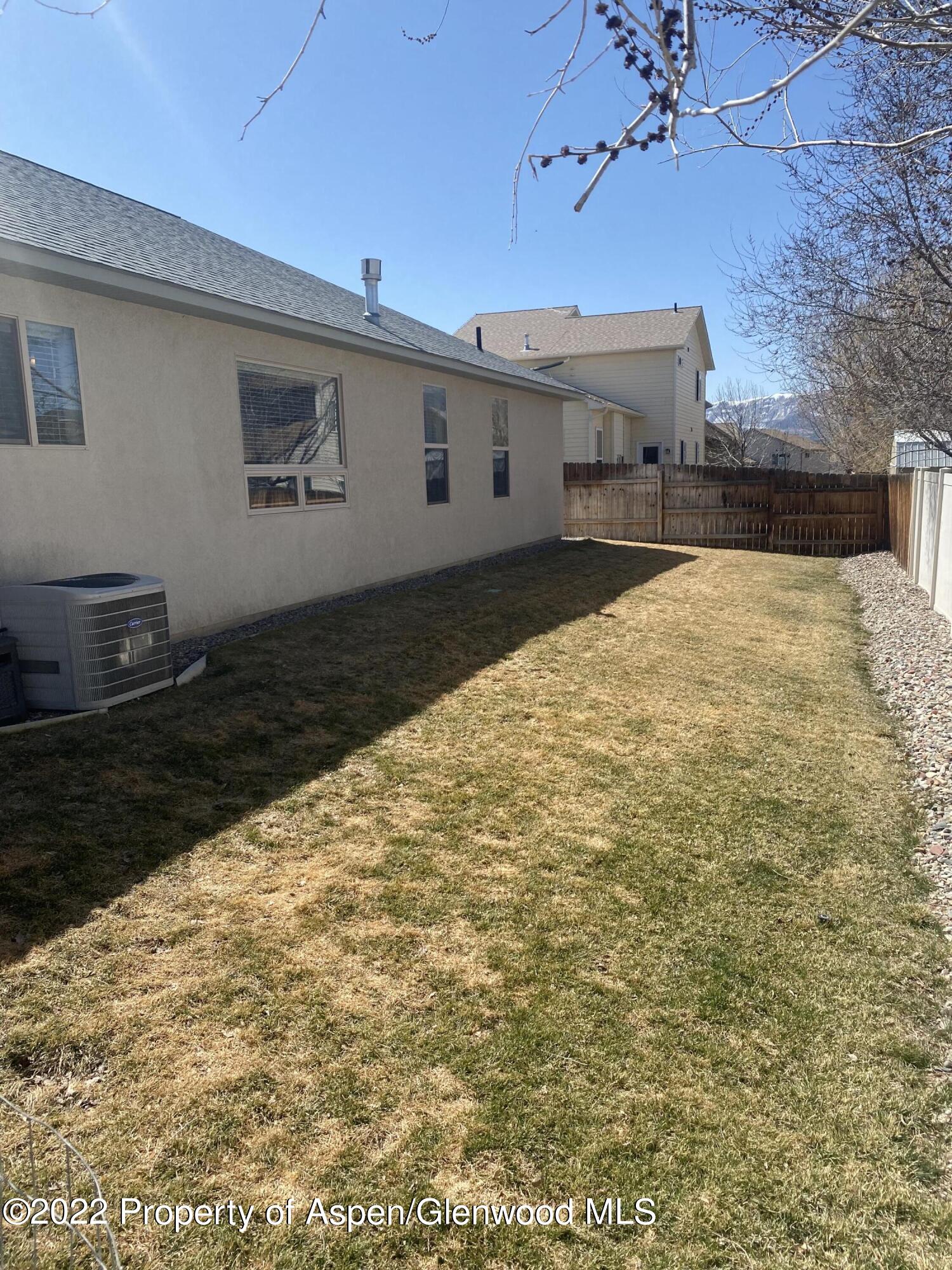 858 East 17th Street Rifle, CO 81650 - Photo 16 of 20 a view of a backyard of a house