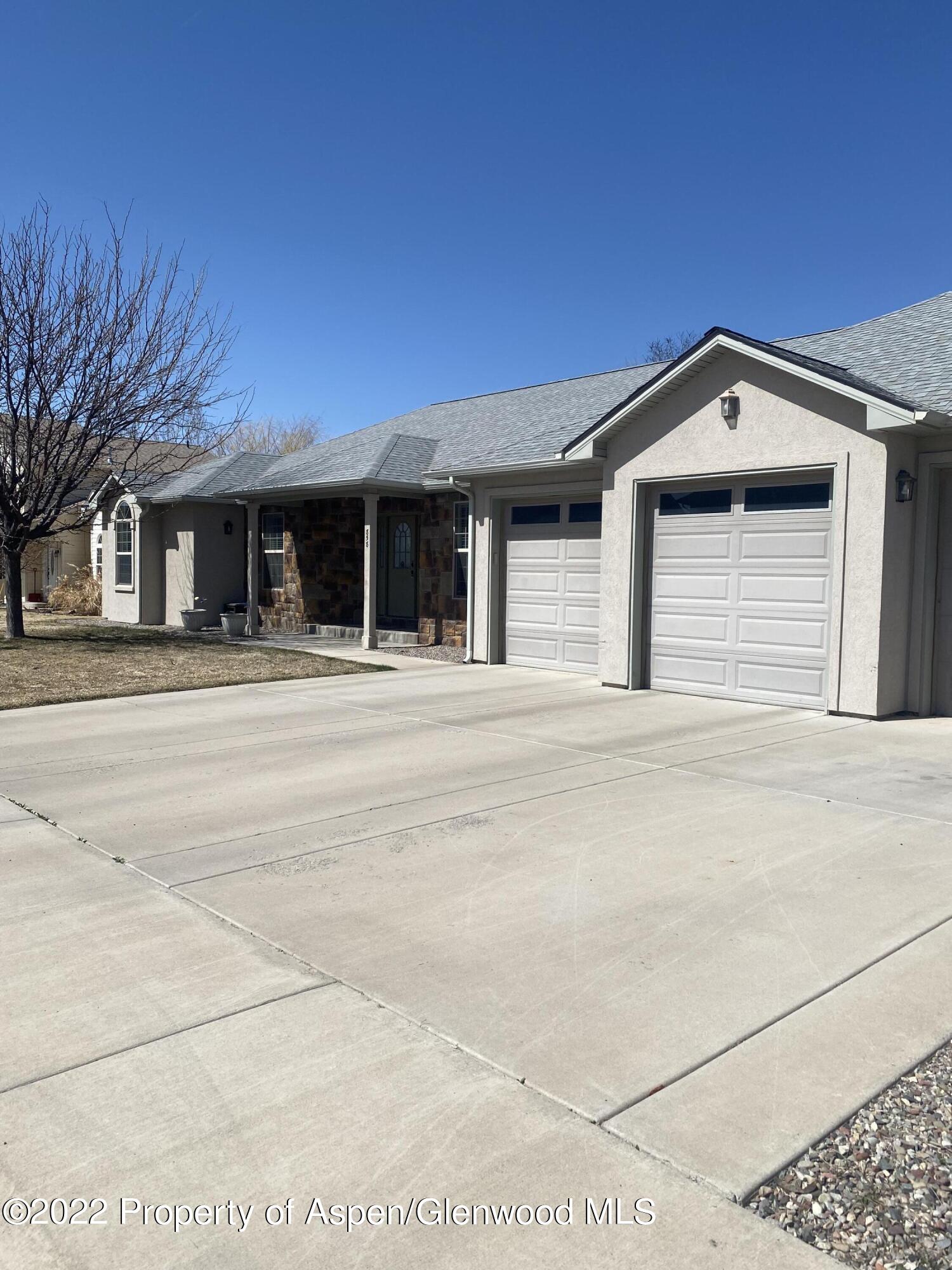 858 East 17th Street Rifle, CO 81650 - Photo 18 of 20 a front view of a house with a garage