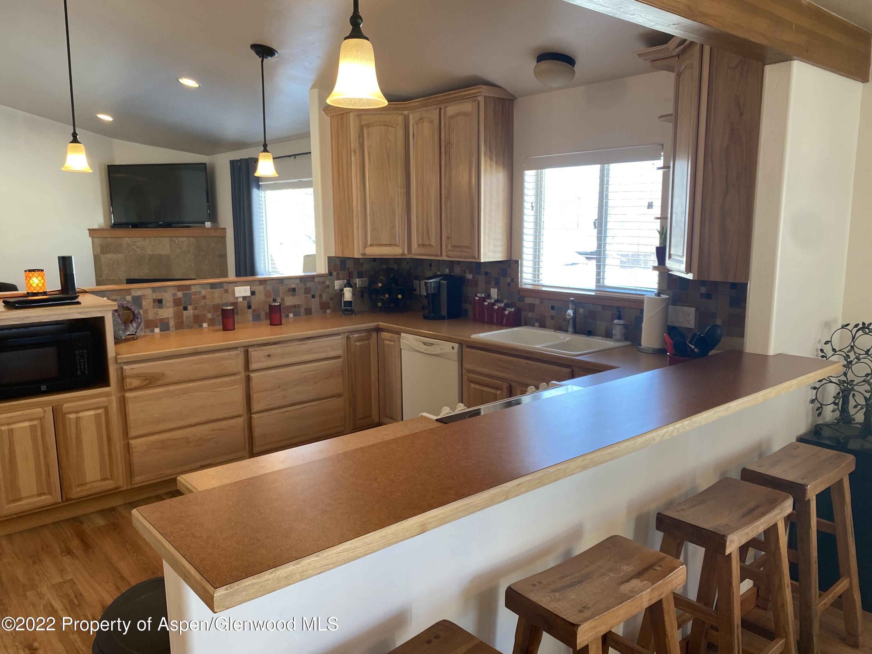 858 East 17th Street Rifle, CO 81650 - Photo 2 of 20 a kitchen with a sink cabinets and window
